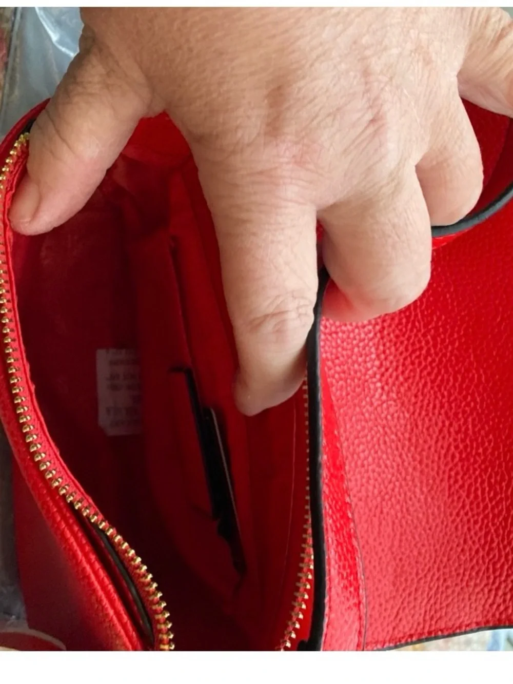 Compact Red Crossbody Bag with Tassel Accent